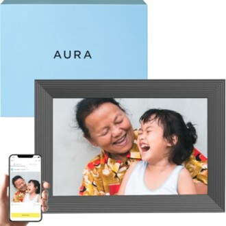 Digital photo frame displaying a smiling adult and child.