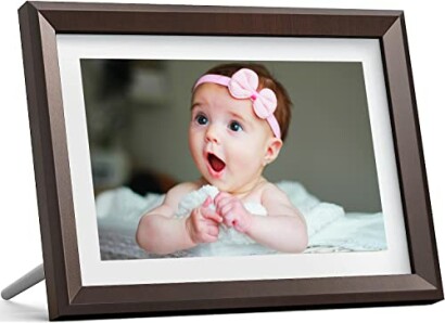 Baby with pink headband in photo frame.