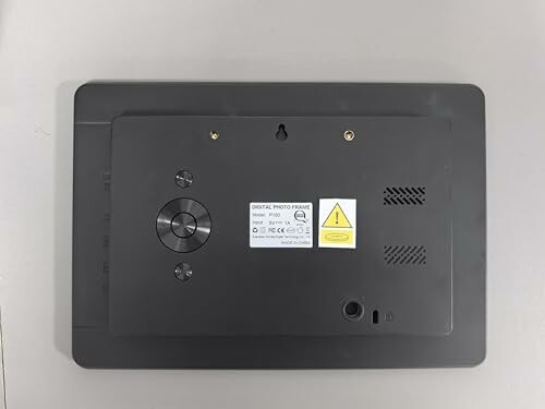 Back view of a digital photo frame showing ports and buttons.