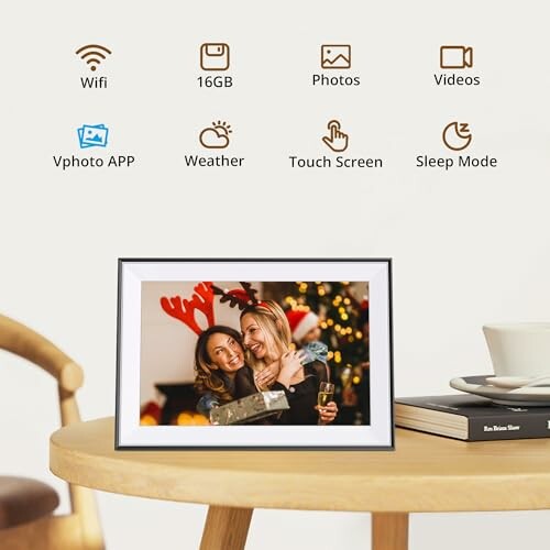 Digital photo frame on a table with feature icons above.