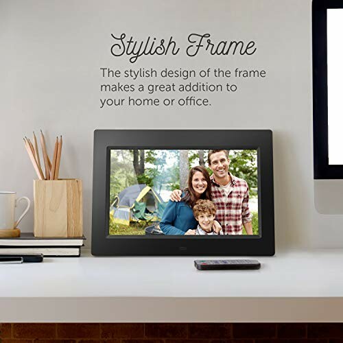 Digital photo frame displaying family picture on desk with stylish decor.