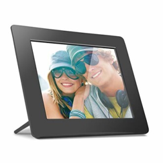 Digital photo frame displaying a smiling couple.