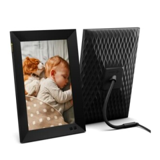 Digital photo frame displaying a sleeping baby and dog.