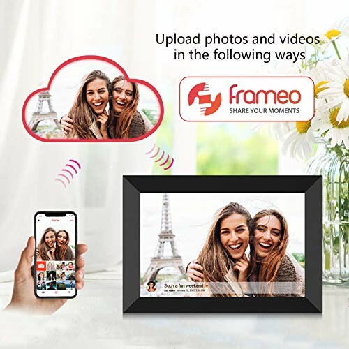 Digital photo frame showing two women with Eiffel Tower, phone uploading image.